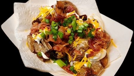 Loaded Smashed Tatters. Loaded with sour cream, shredded cheese, chives and a heaping amount of hickory smoked bacon.